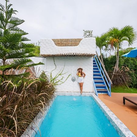 Le Resort And Villas Rawai Ngoại thất bức ảnh A pool at a resort in Phuket, Thailand